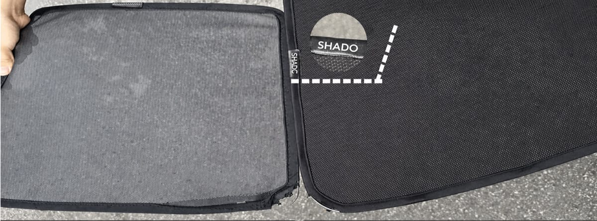Two shade panels side by side. The one on the left has faded to a patchy grey; ours on the right is still deep black, with a bound edge and a branded tab.