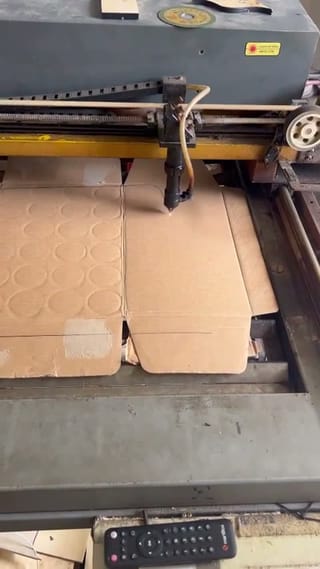 CNC machine precision-cutting a window pattern