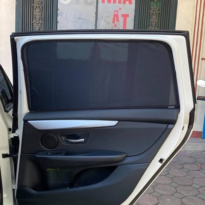 Custom-fit sun shades fitted to a BMW 218i 7 seats