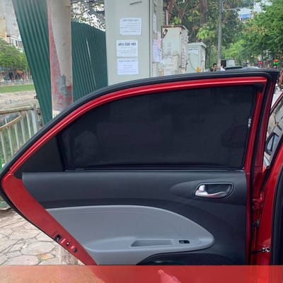 Custom-fit sun shades fitted to a KIA SOLUTO