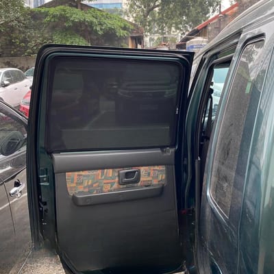 Custom-fit sun shades fitted to a SUZUKI WAGON