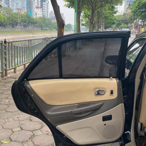 FORD LASER custom-fit car window sun shades — photo 1
